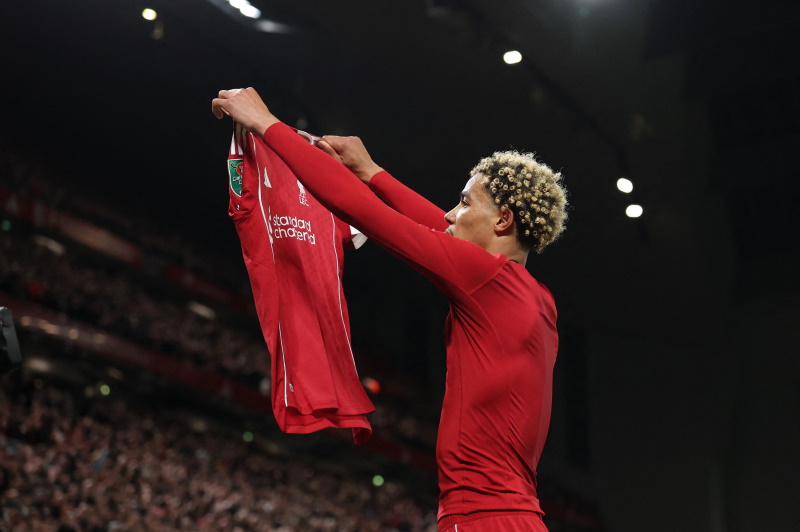 Liverpool striker Hugo Ekitike takes his shirt off to celebrate his goal, leading to his second...