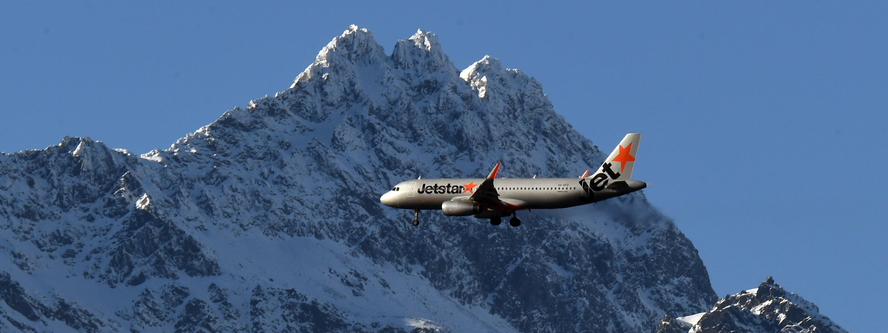 A Jetstar Airbus A320 passes The Remarkables as it heads in to land at Queenstown airport. Photo:...