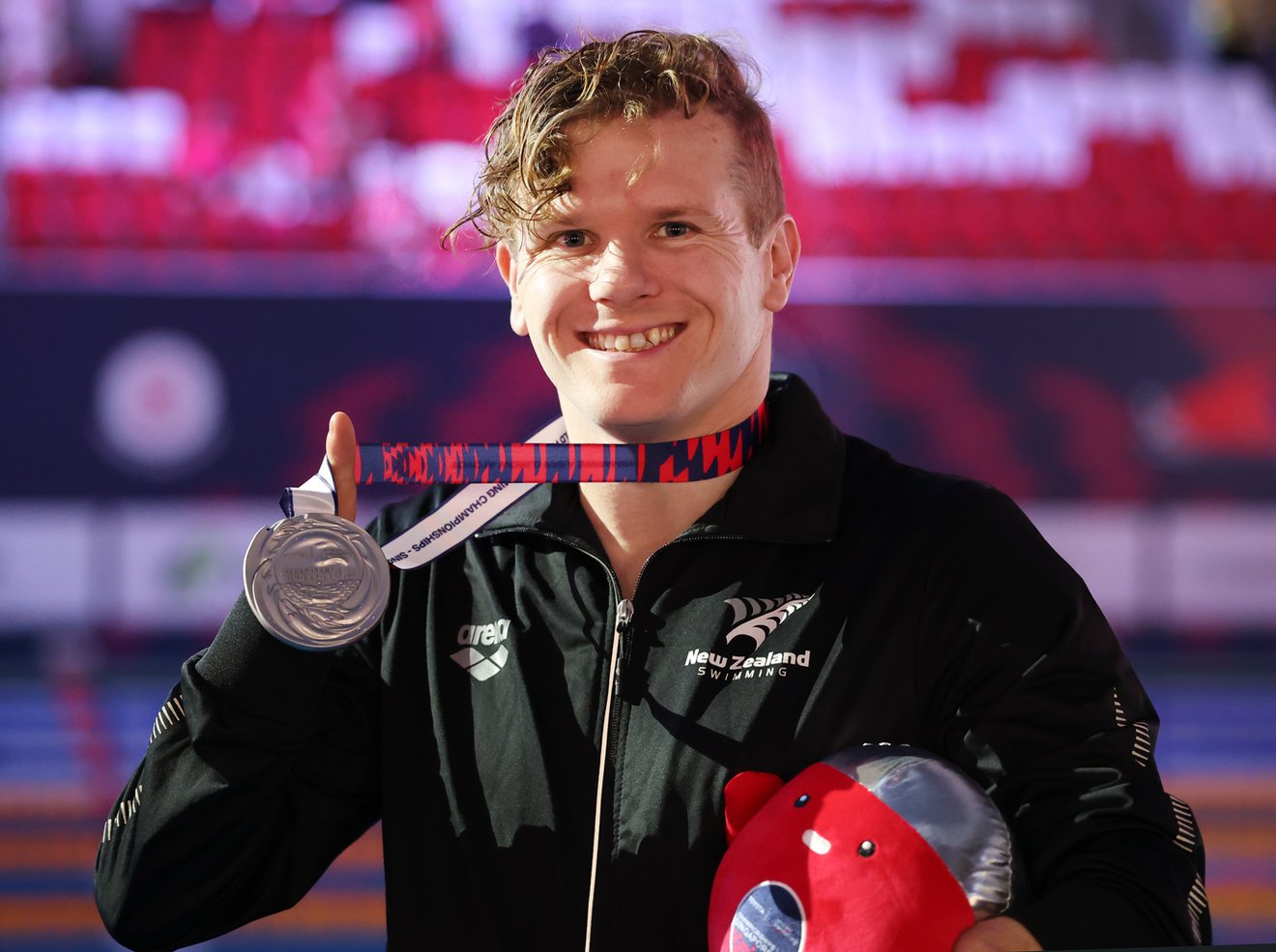 Cameron Leslie celebrates his silver medal in Singapore. PHOTO: SWIMMING NEW ZEALAND
