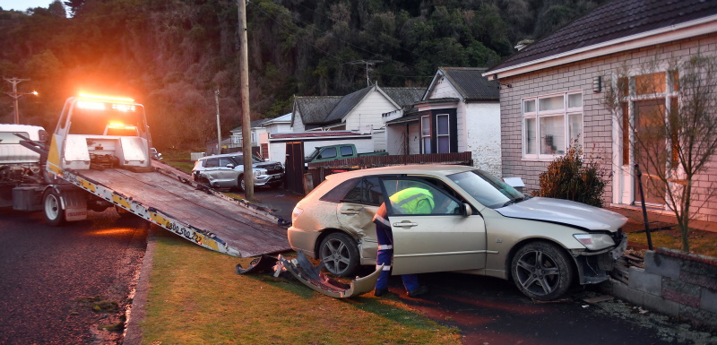 Tow trucks load up two cars following a crash in Malvern St, Glenleith on Sunday. Photo: Stephen...