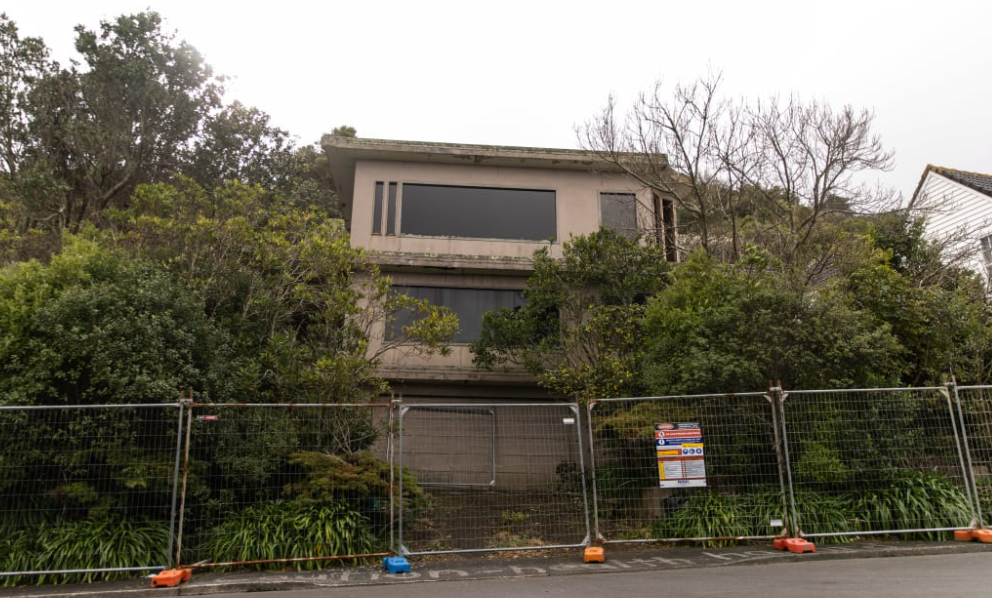 Gates have gone up in front of the decaying house. Photo: RNZ
