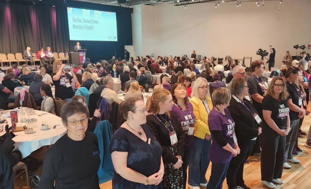 Nurses Organisation delegates turn their back on Health Minister Simeon Brown during his speech...