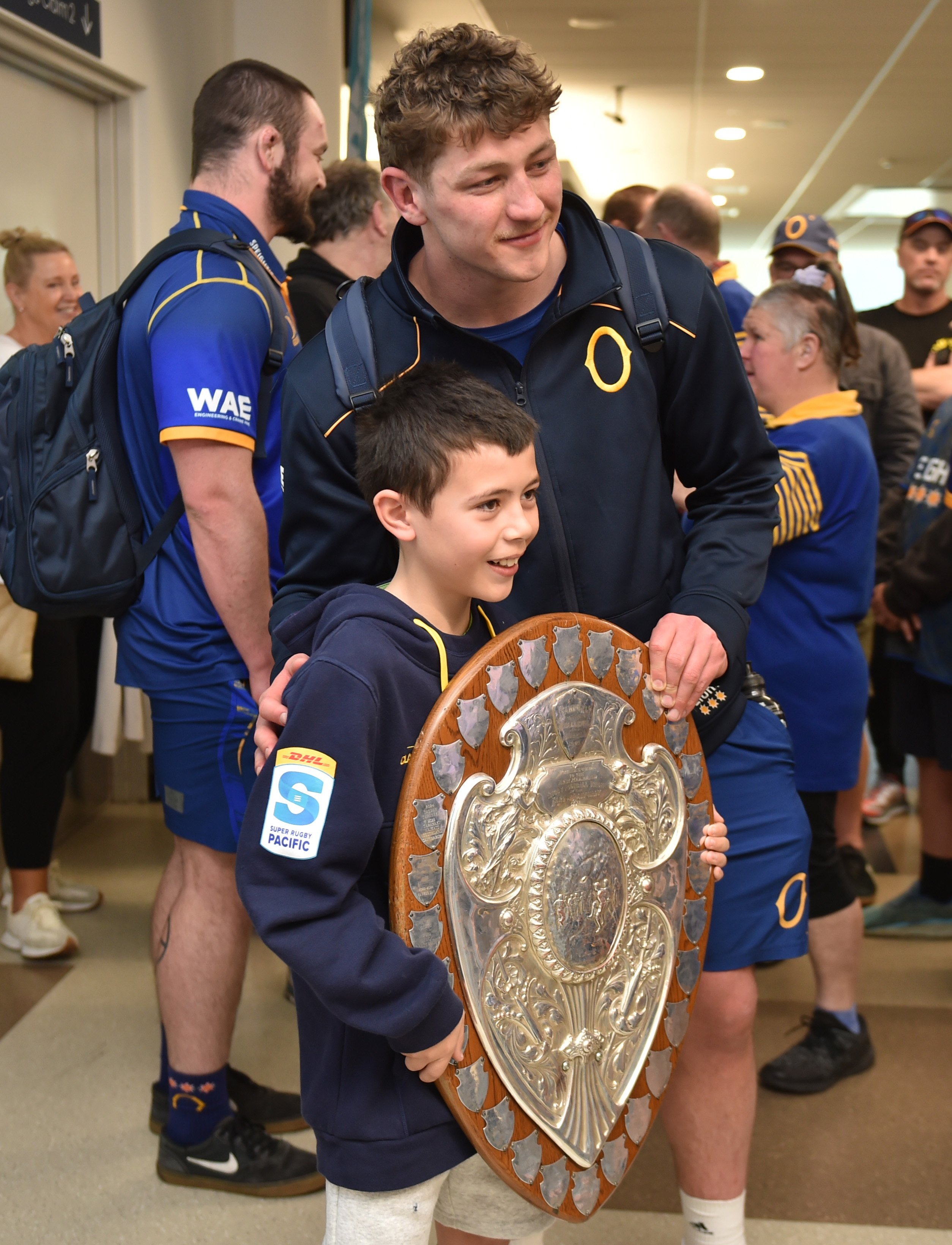 Lachie Nooroa, 10, gets to hold the famous Log o’ Wood, the Ranfurly Shield, alongside star Otago...