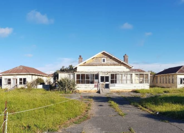 The abandoned buildings before the blaze. Photo: Google Maps (file)