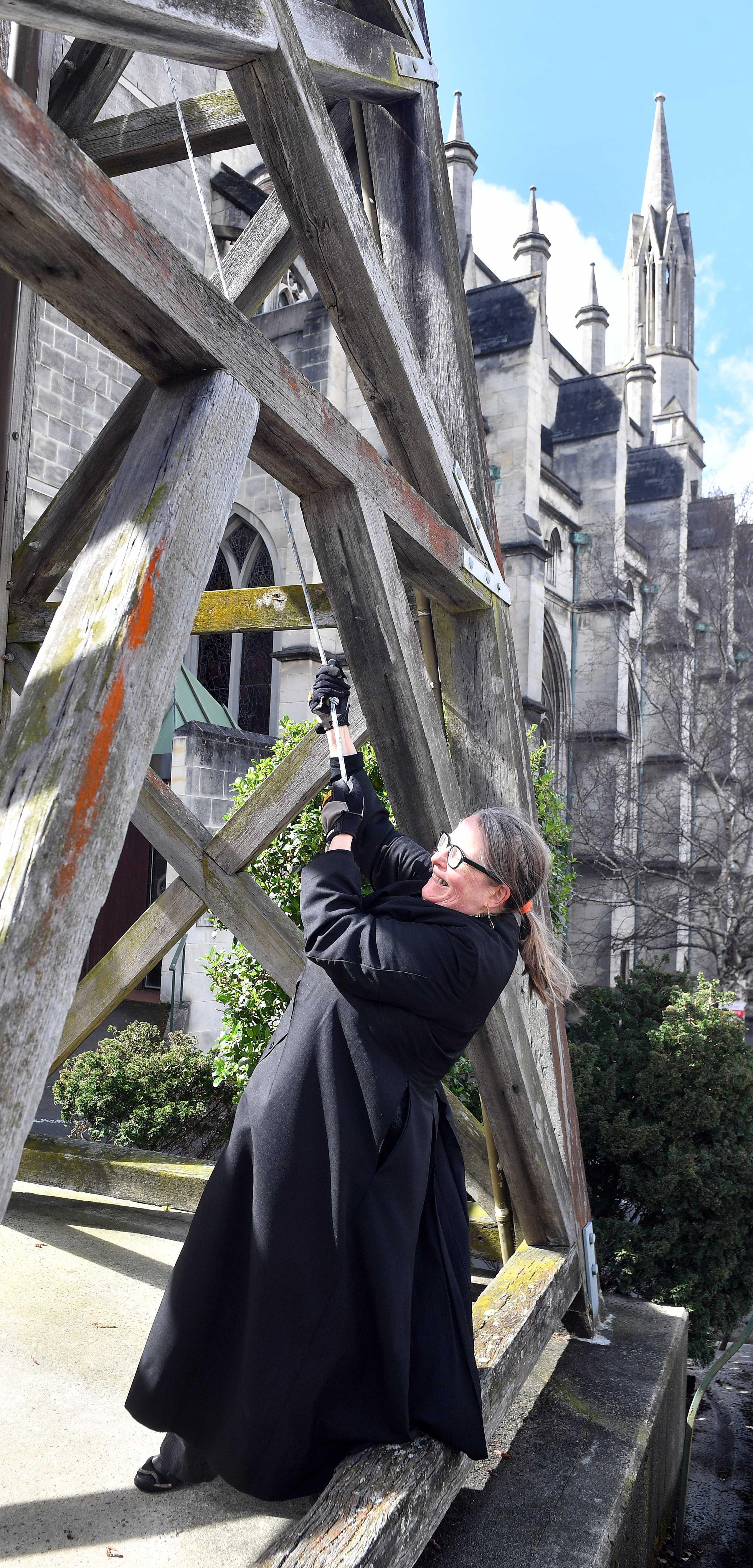 Rev Dr Andrea McDougall rings the bell yesterday. PHOTO: STEPHEN JAQUIERY 