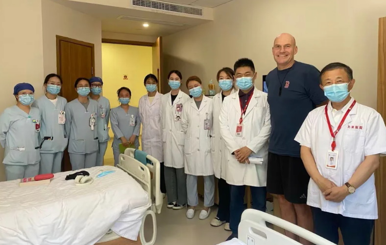 Stu Lye with hospital staff in China where he underwent CAR T-cell therapy. Photo: Supplied via RNZ