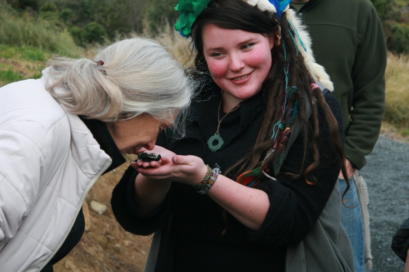 Dr Goodall takes a sniff of kiwi poo at Orokonui Ecosanctuary with educator Tahu Mackenzie in...