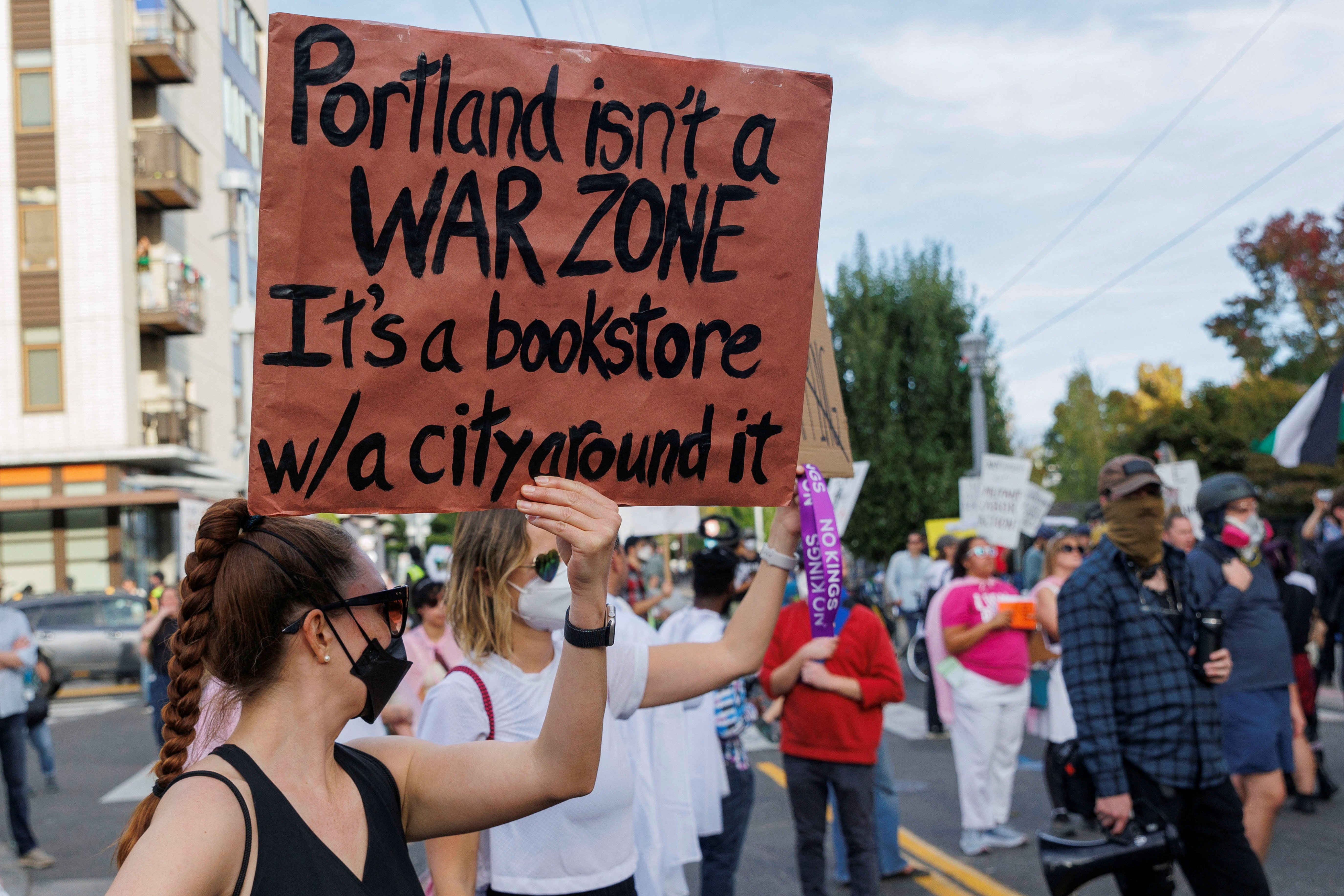 A demonstrator in ‘‘war-ravaged’’ Portland, Oregon. PHOTO: REUTERS

