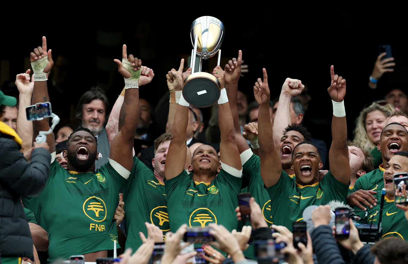 South African players celebrate with the Rugby Championship trophy after the match. Photo: Reuters