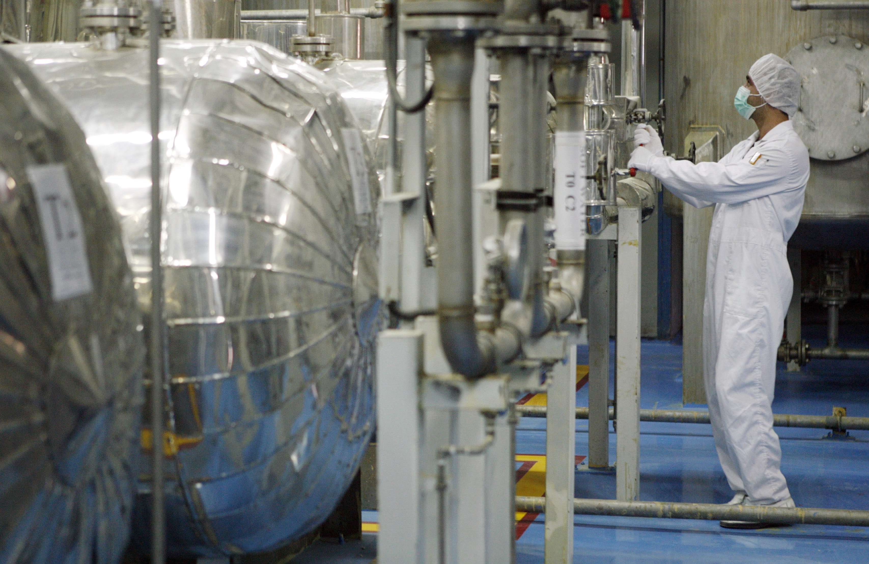 A technician checks valves at the uranium conversion facility in Isfahan, 450km south of Tehran,...