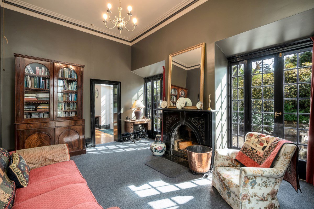 The fireplace in the study is one of four original ones in the house. Photo: Rory Allardice