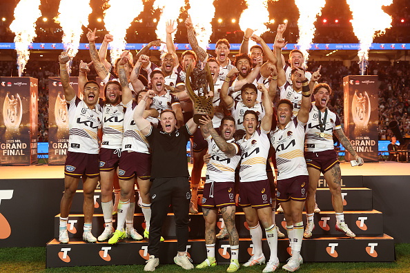 Adam Reynolds and Billy Walters of the Broncos hold aloft the Provan-Summons Trophy as the team...