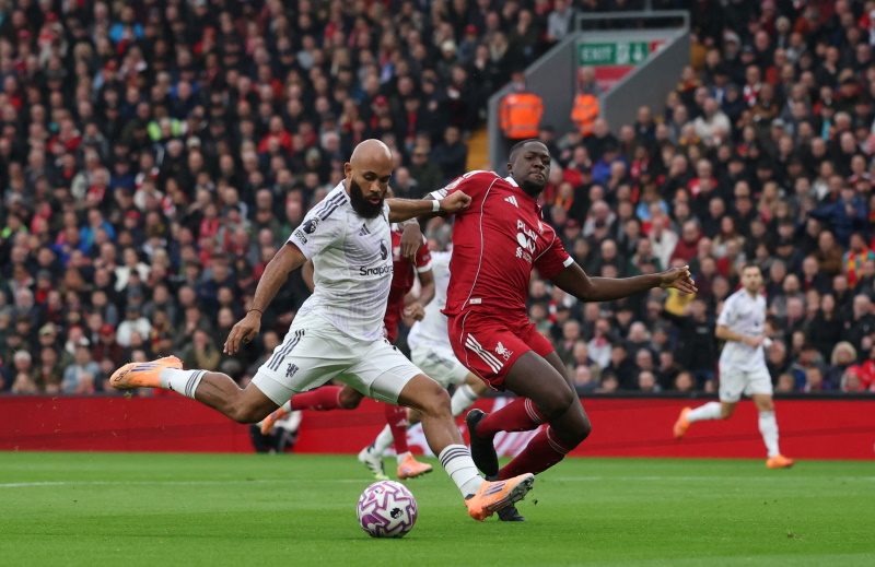 Manchester United's Bryan Mbeumo scores their first goal against Liverpool at Anfield this...