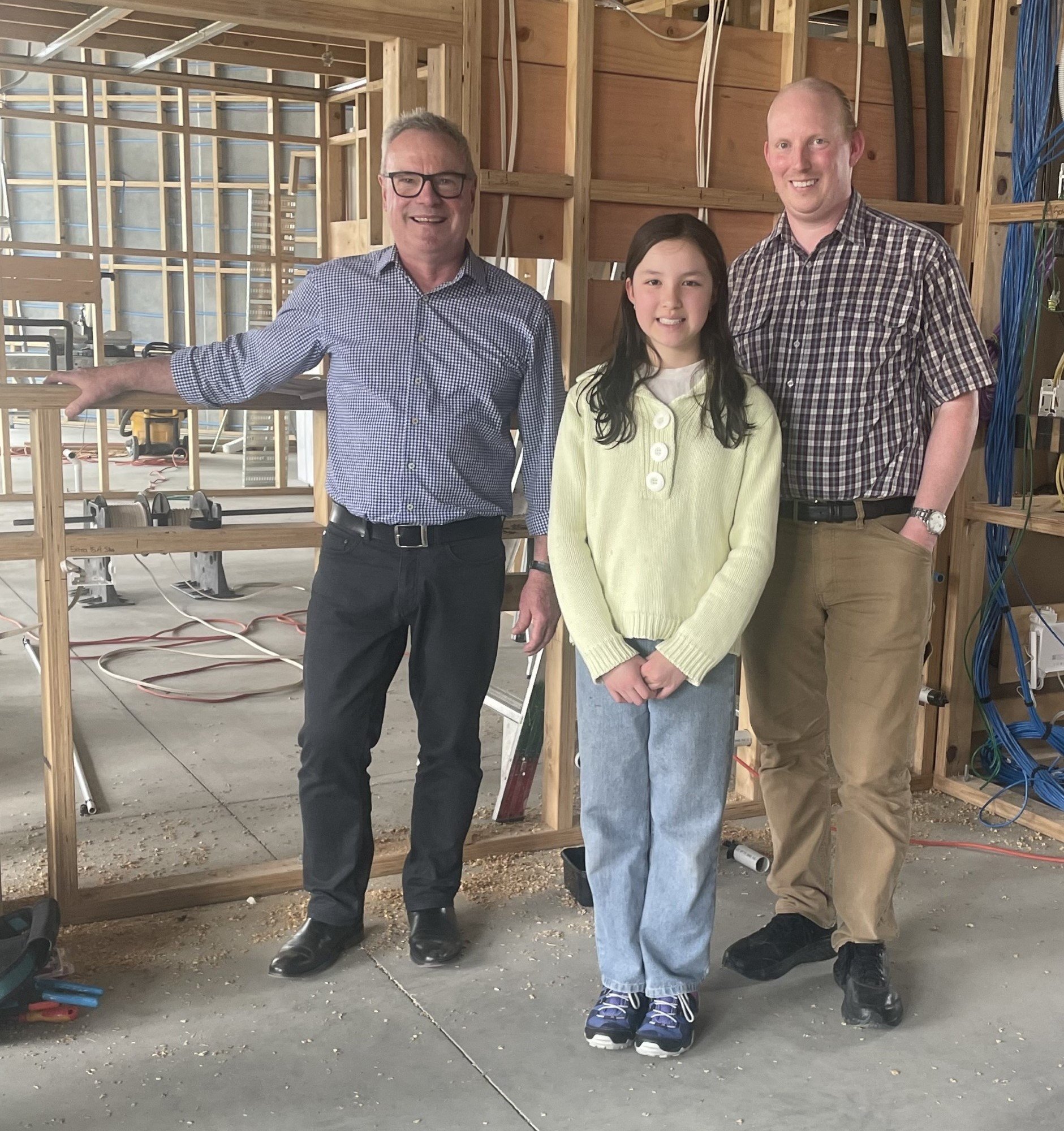 Clutha Licensing Trust General Manager Ross Balloch (left) with competition winners Evie...