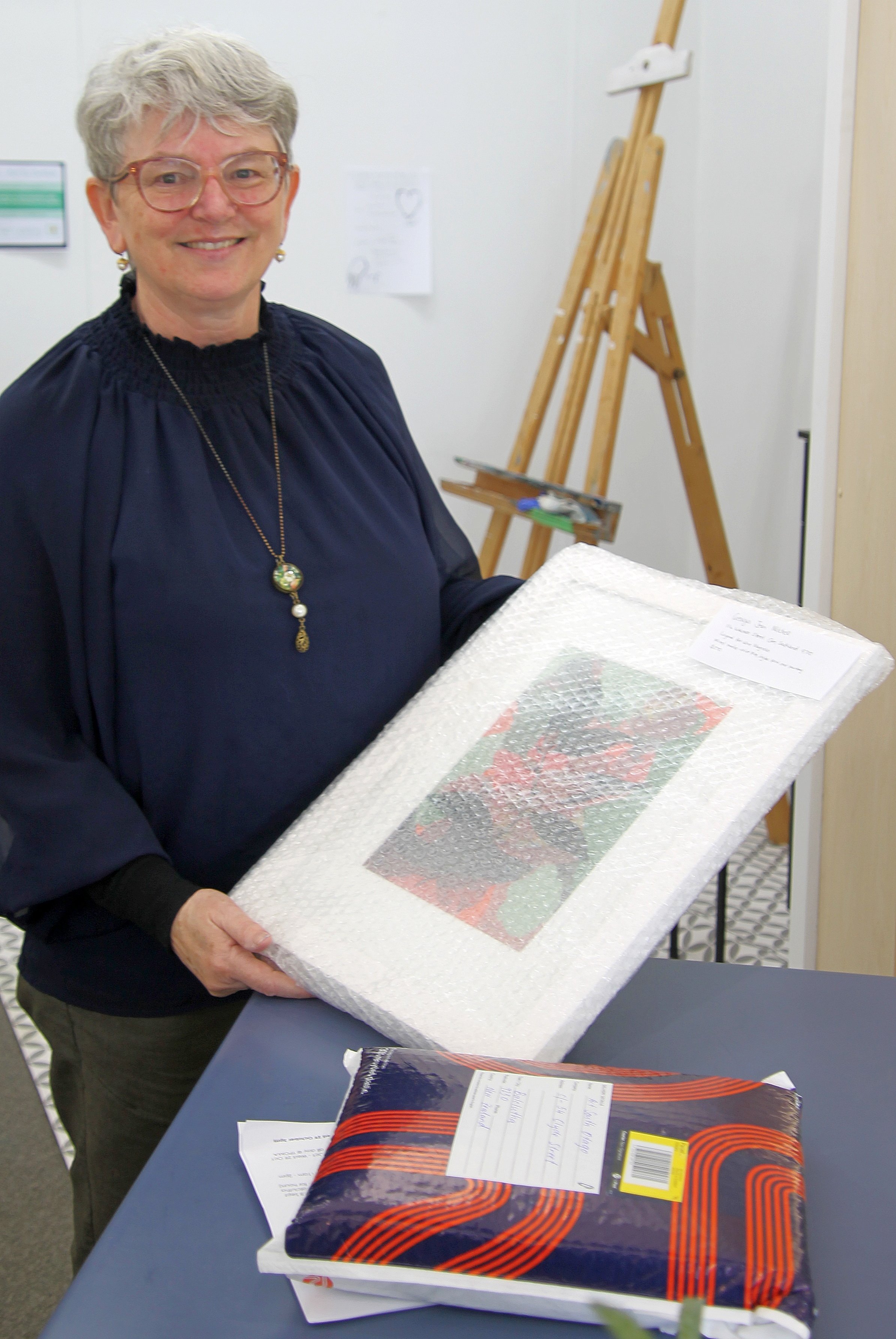 Belinda Mason prepares artworks received for the Art South Otago annual exhibition at Te Pou Ō...
