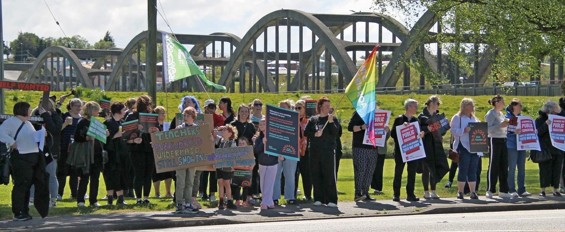 About 70 people, mostly teachers and some school children, rallied beside State Highway1 in...