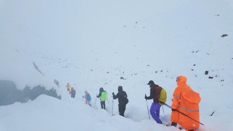 Hikers are guided to safety after a snow storm left them stranded near the face of Everest. Photo...