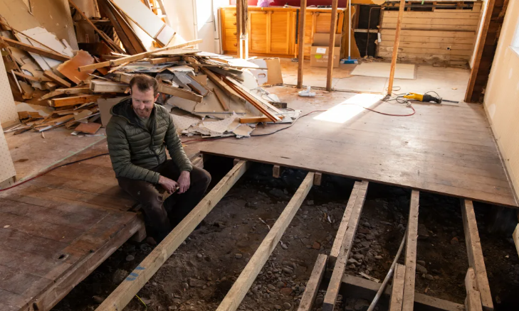 Warren Fitzgerald looking at the uncompleted work at his property. Photo: RNZ / Samuel Rillstone