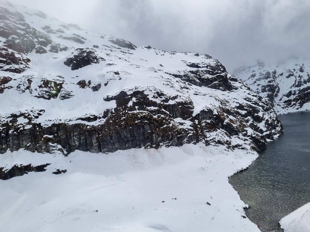Te Routeburn Track traverses these snow-laden bluffs above Lake Harris. Photos: DOC