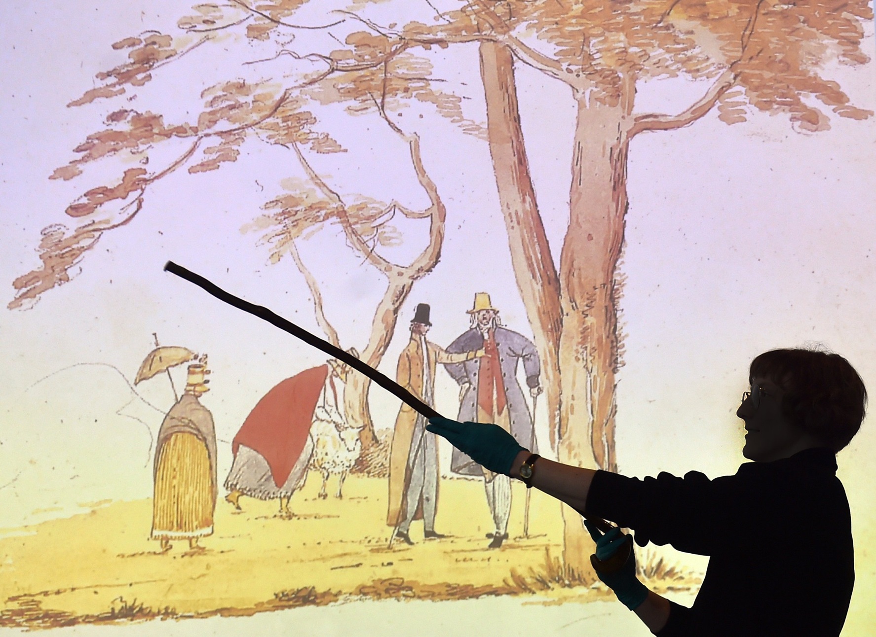 Tūhura Otago Museum humanities assistant collections manager Merryn Chynoweth holds up a walking...