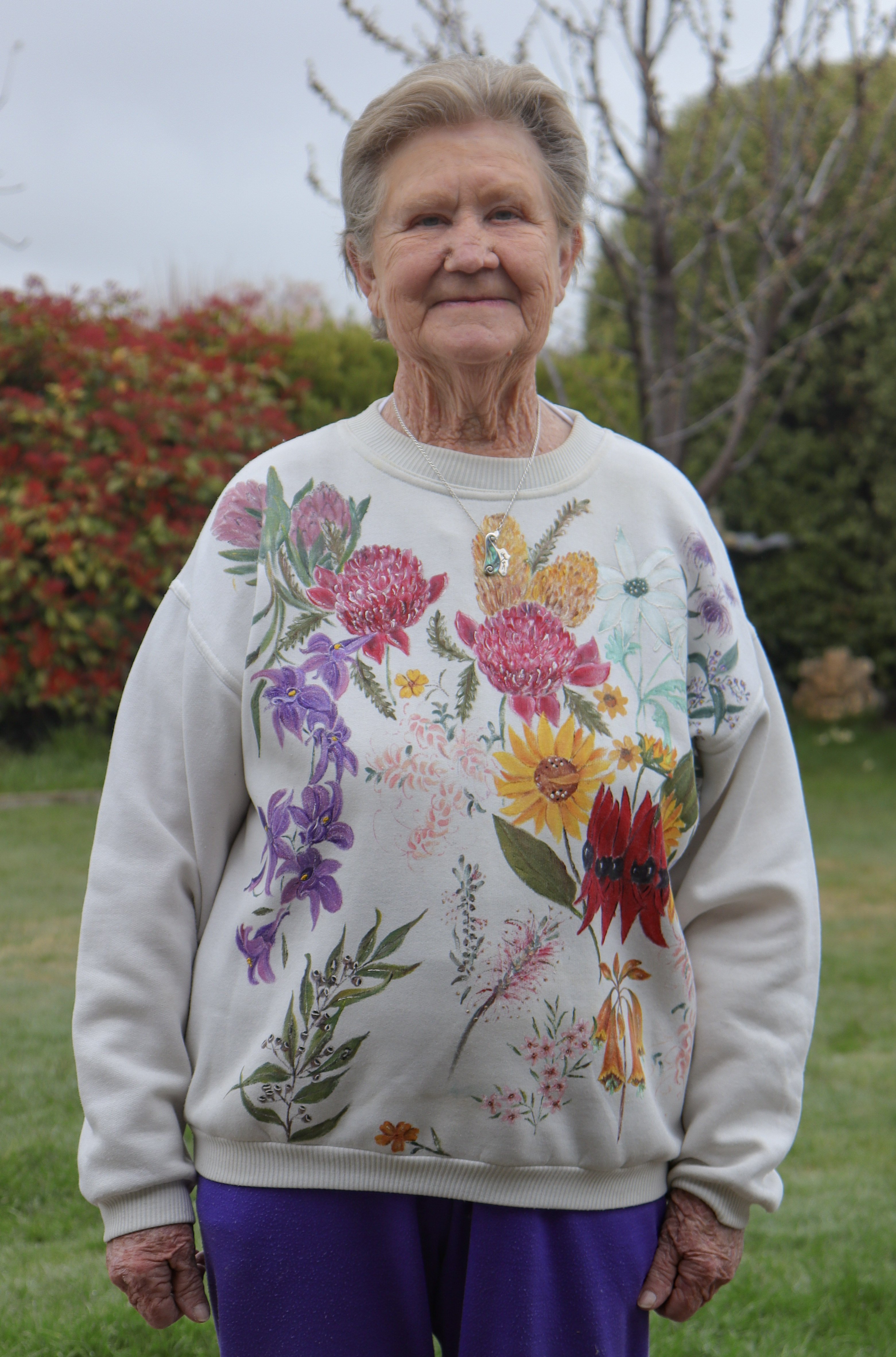 Milburn wears one of her own creations, where she used fabric paint to add florals to a jumper.