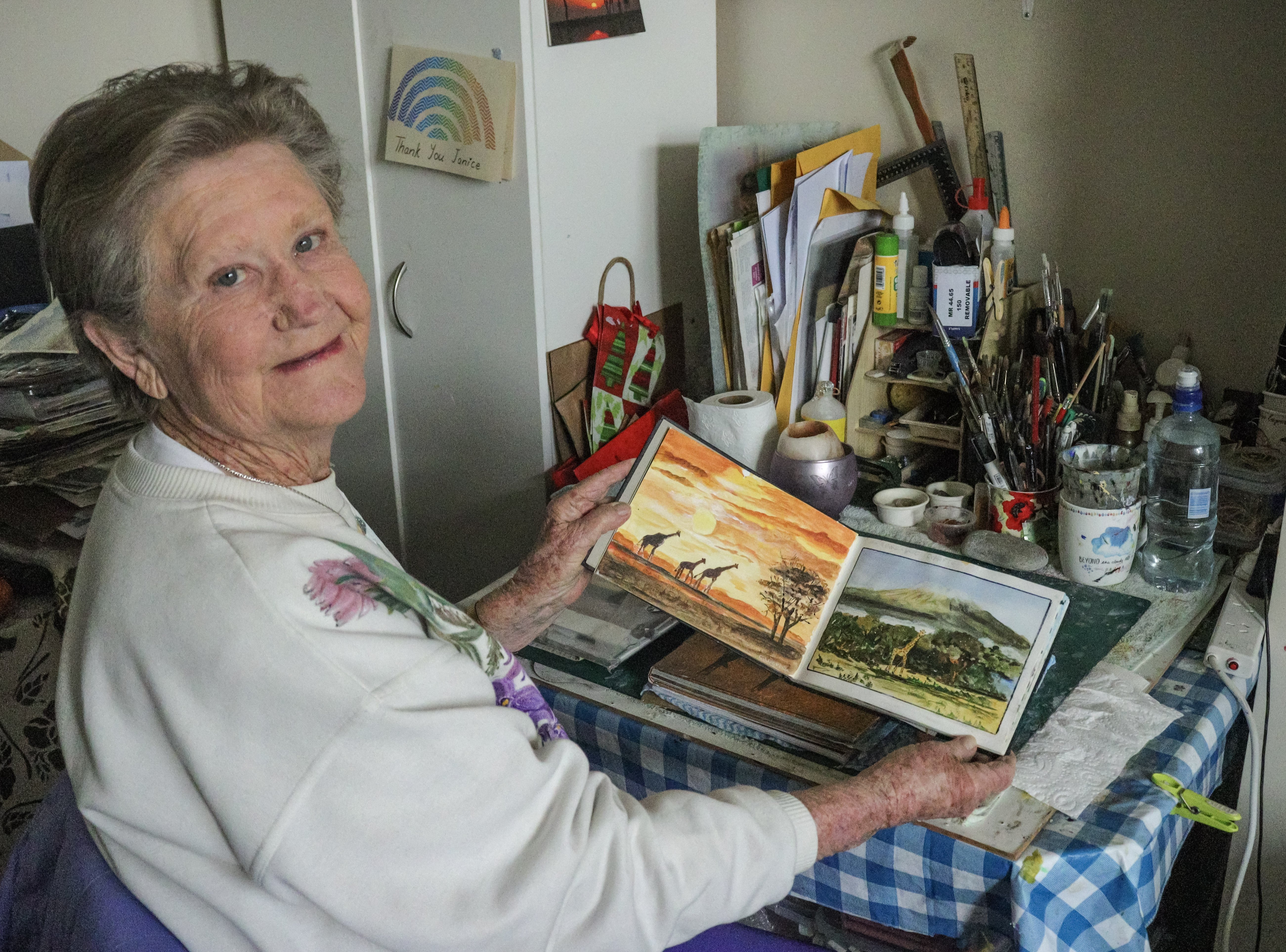 Sitting at her painting table, painting East African wildlife is Janice Milburn’s way of...