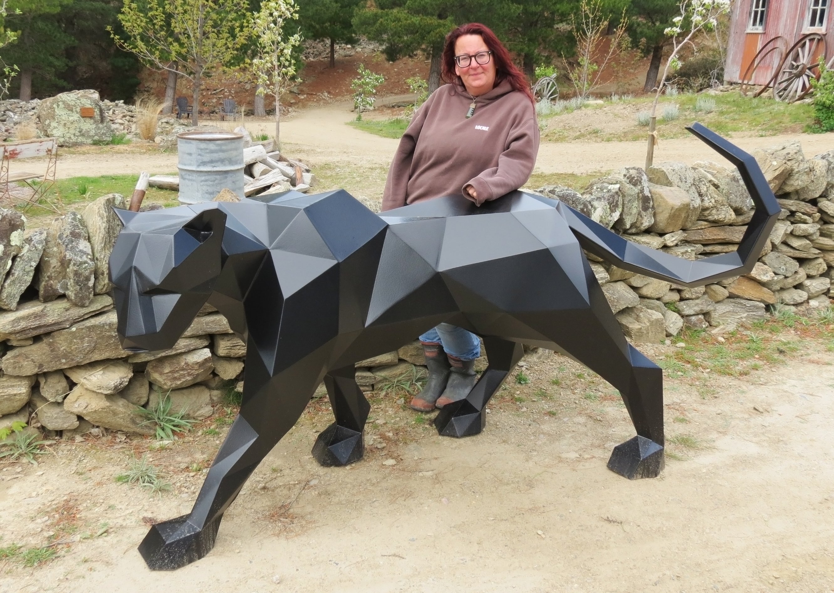 Art on the Goldfields organiser Tracy Stroud stands beside Silent Grace, by Leroy Spijkerbosch,...