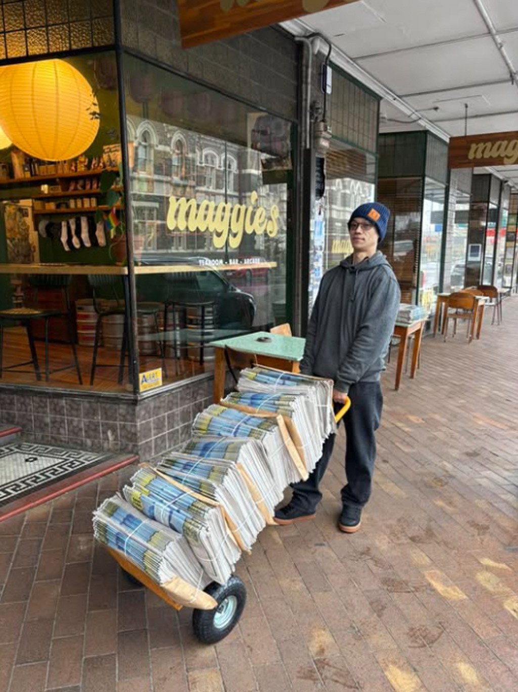 On September 18, Dunedin City Council election candidate Benedict Ong prepares to give away...