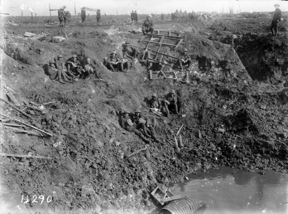 New Zealand engineers rest in a large shell crater following the Battle of Passchendaele. PHOTO:...