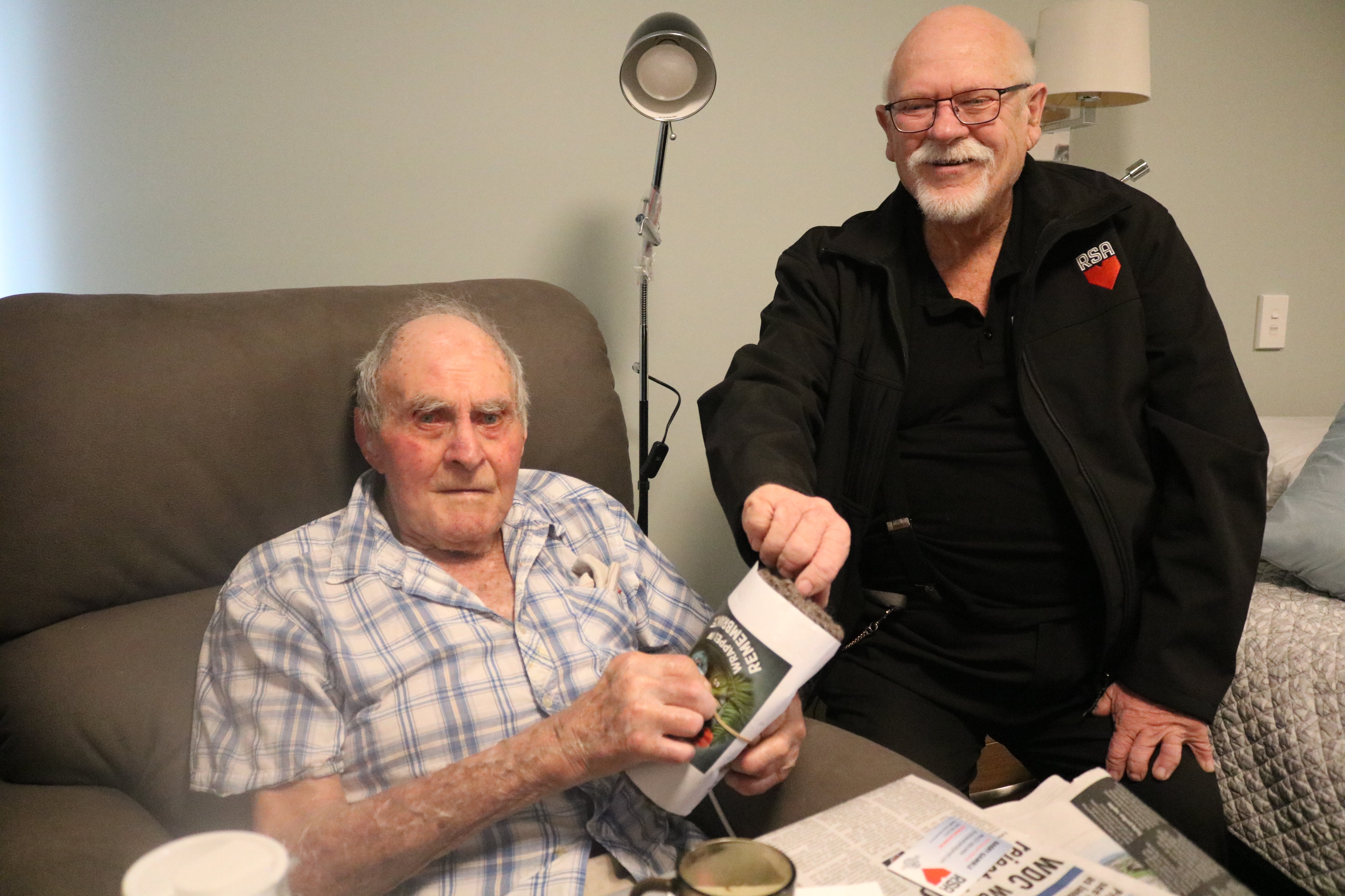 Oamaru war veteran Don Fraser, 95, receives a hand-knitted scarf as part of Operation Wrapped in...