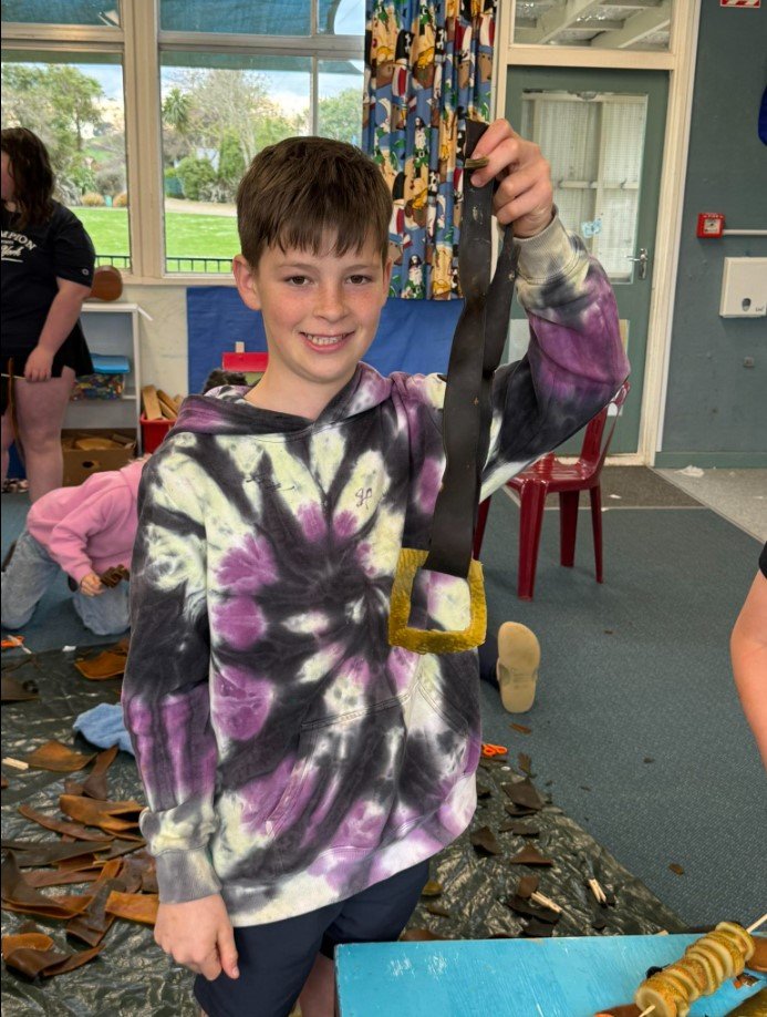 Hayden Carpenter, 12, with his crafted kelp belt and buckle. PHOTOS: JULES CHIN