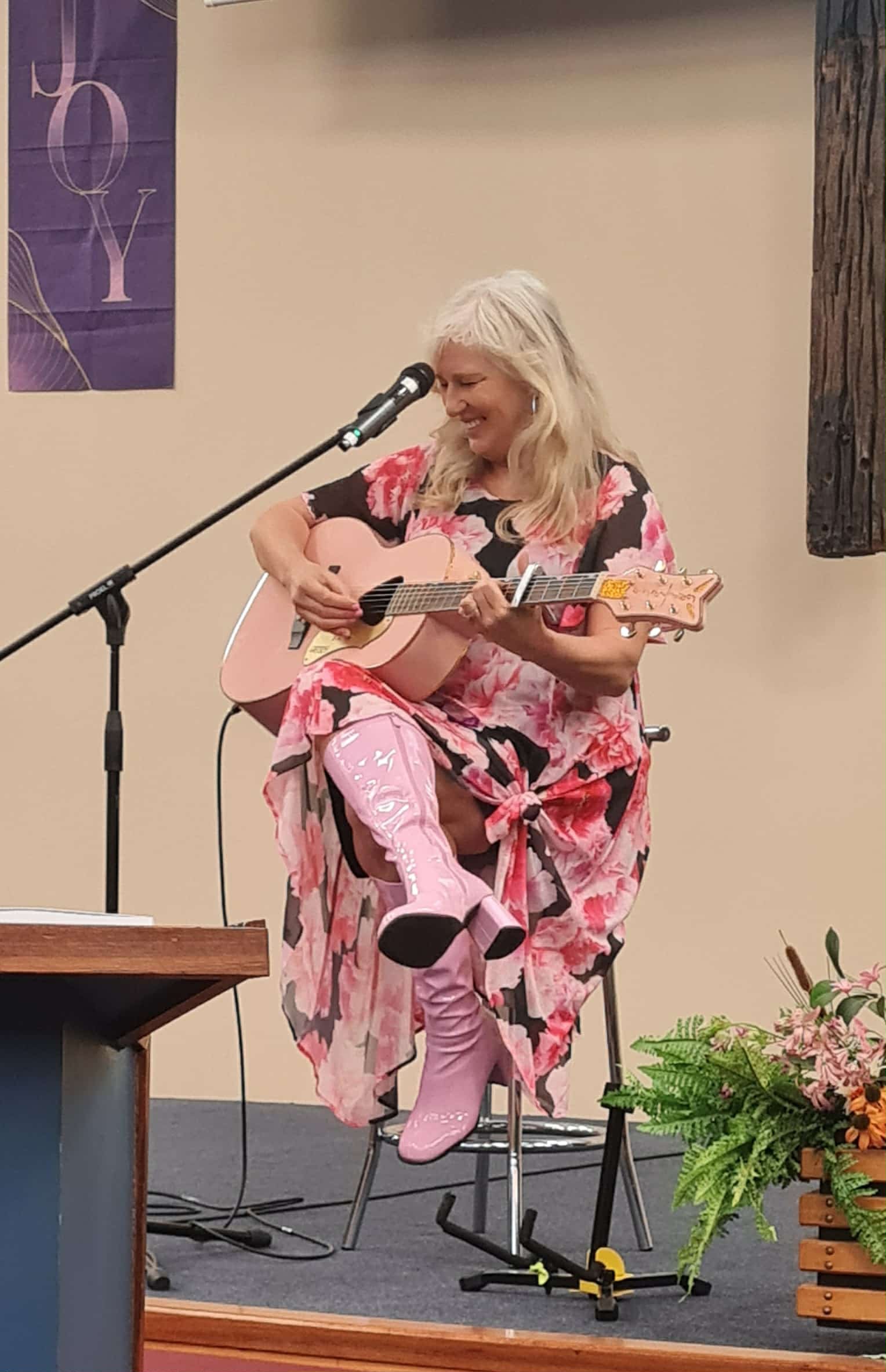 Award-winning singer and songwriter Julia Grace entertains the audience at the Be Kind to Your...