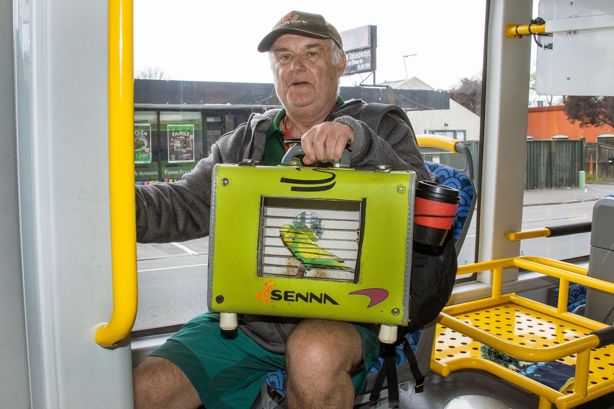 Tony Church and his budgie 'Monster' riding the bus on Stanmore Rd. Photo: Geoff Sloan