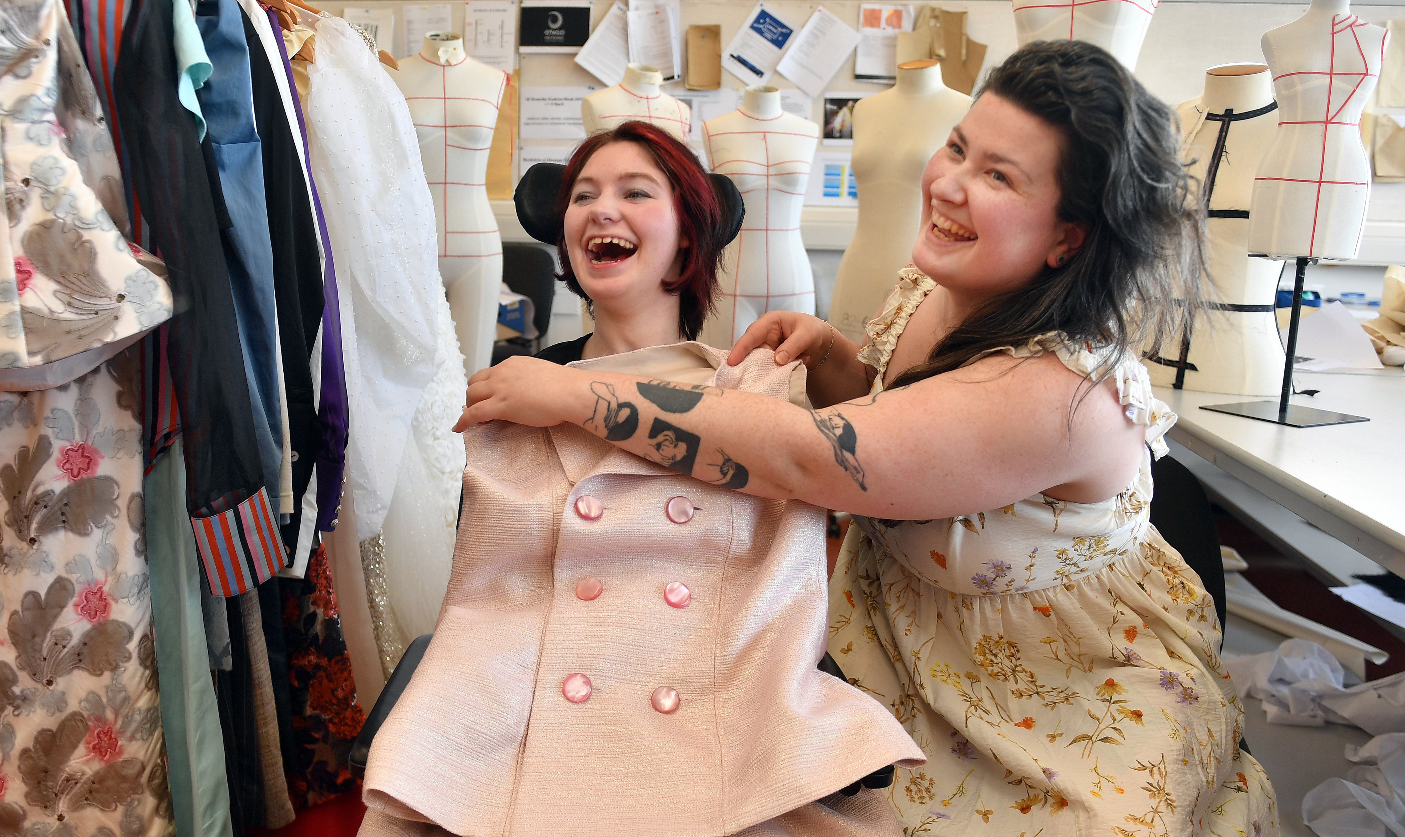 Poppy McConville (left) sizes up her Tegan Vickery-designed outfit for tomorrow night’s fashion...