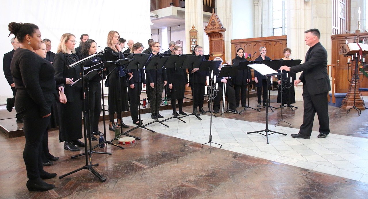 Dunedin’s Southern Consort of Voices, conducted by Daniel Kelly (right), rehearse in preparation...