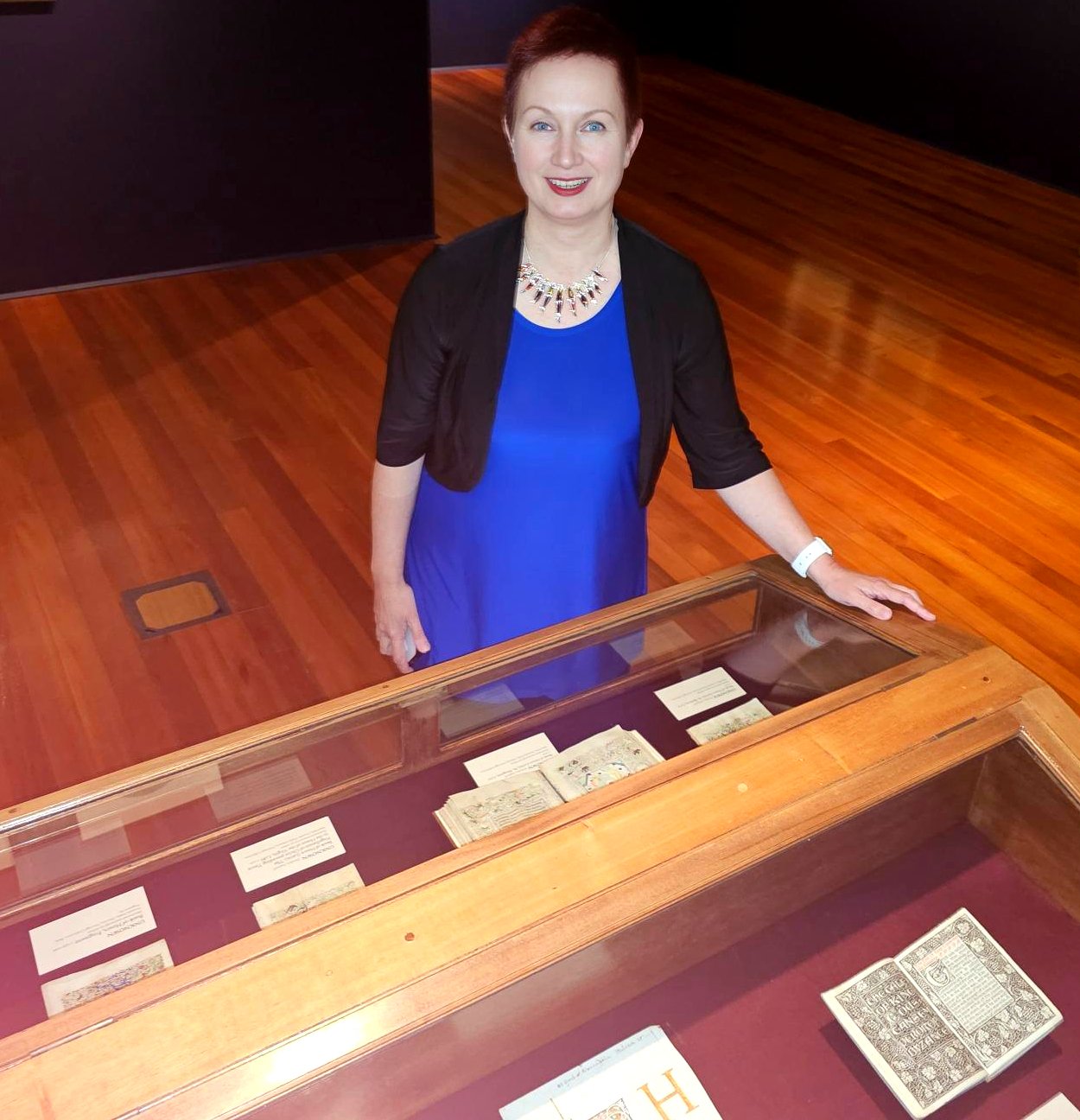 Prof Simone Celine Marshall inspects a collection of medieval books of hours at the Dunedin...