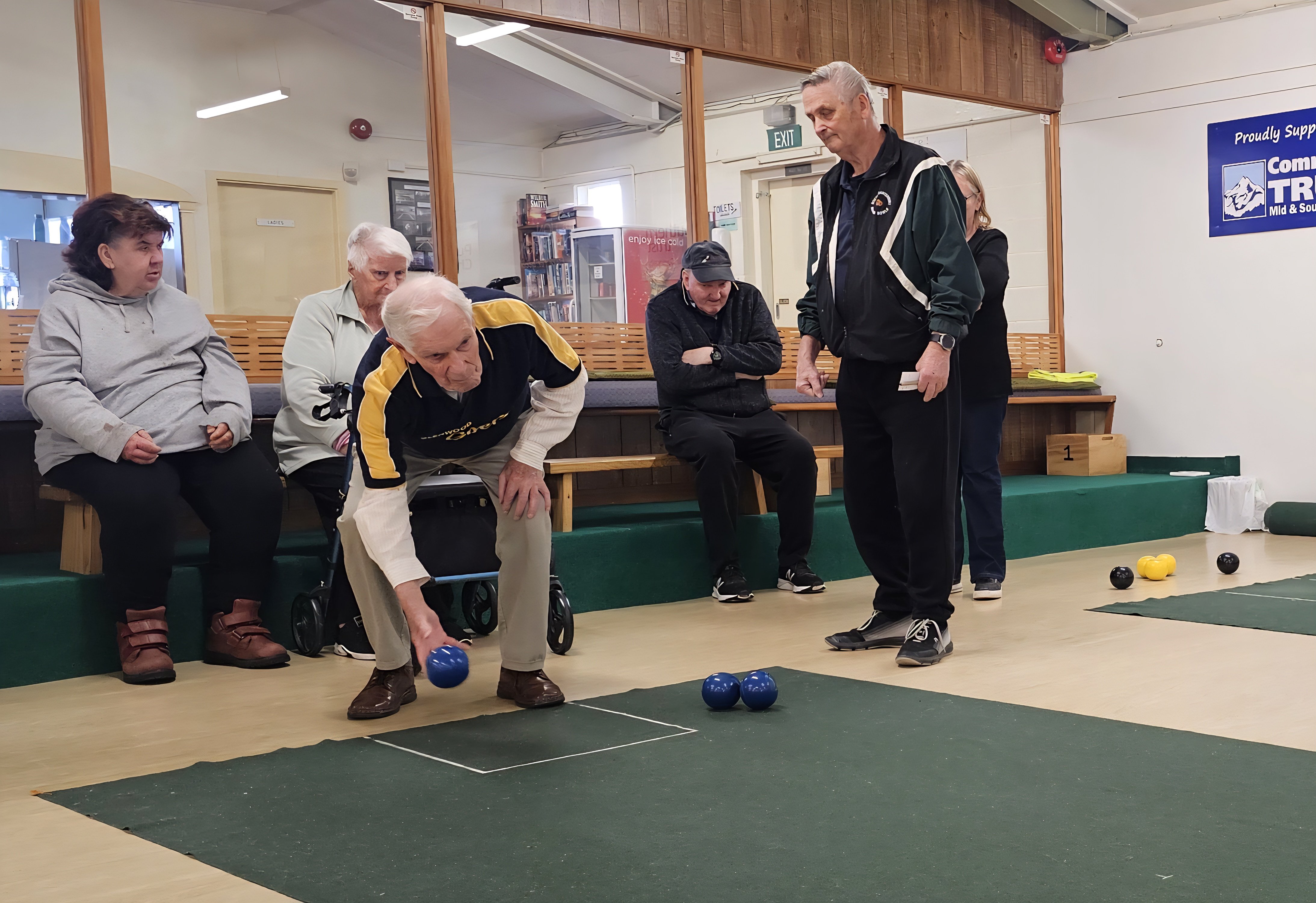 Basil Mansfield prepares to play a shot under the watchful eye of Timaru Indoor Bowls club...