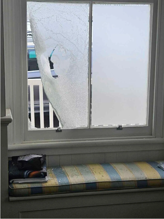 A photo posted to social media shows damage to the window from inside the house. Photo: Supplied 