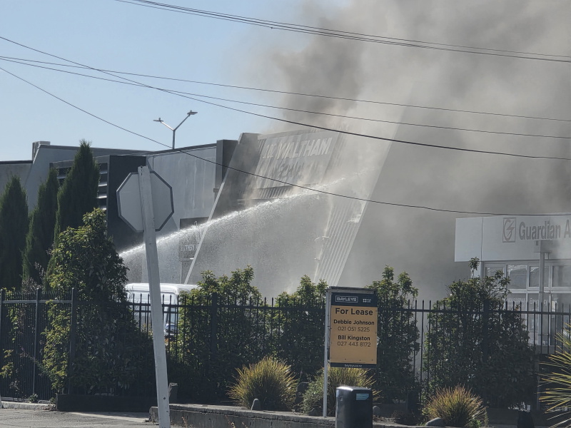 Firefighters battle a blaze in Coleridge St in Christchurch. Photo: Daniel Alvey