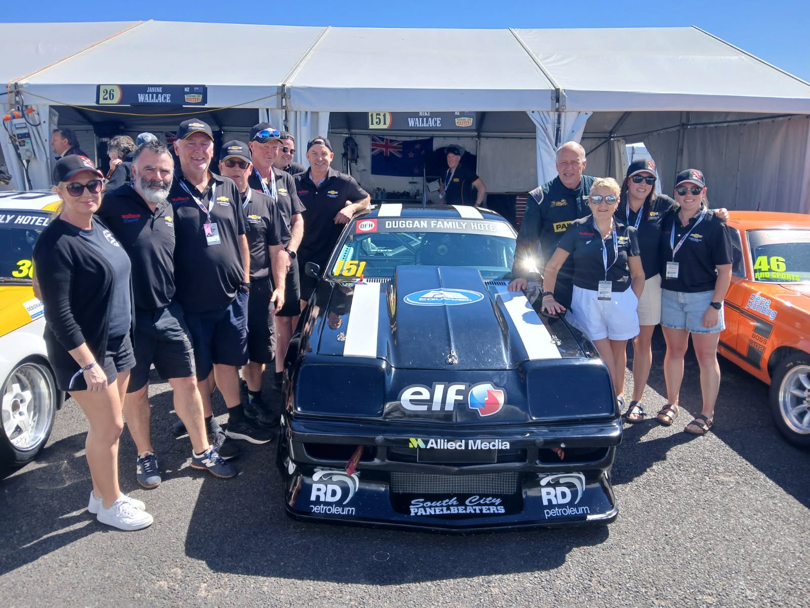 Dunedin driver Mike Wallace (fourth from the right) celebrates a good day at the Bathurst 1000...