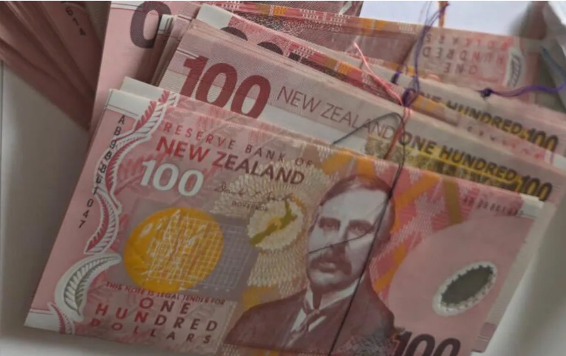 The cleaner opened the cushion and pulled out an old plastic bag full of $100 notes. Photo: Supplied