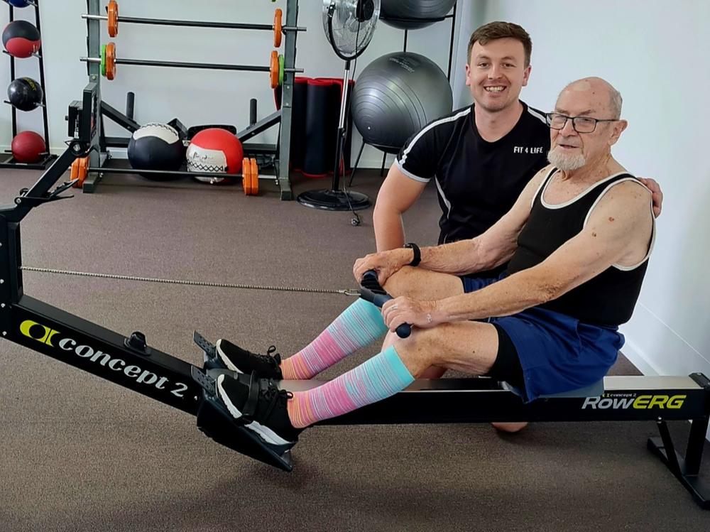 Merv Grewar with personal trainer Angus McKenzie-Heard. Photo: Givealittle