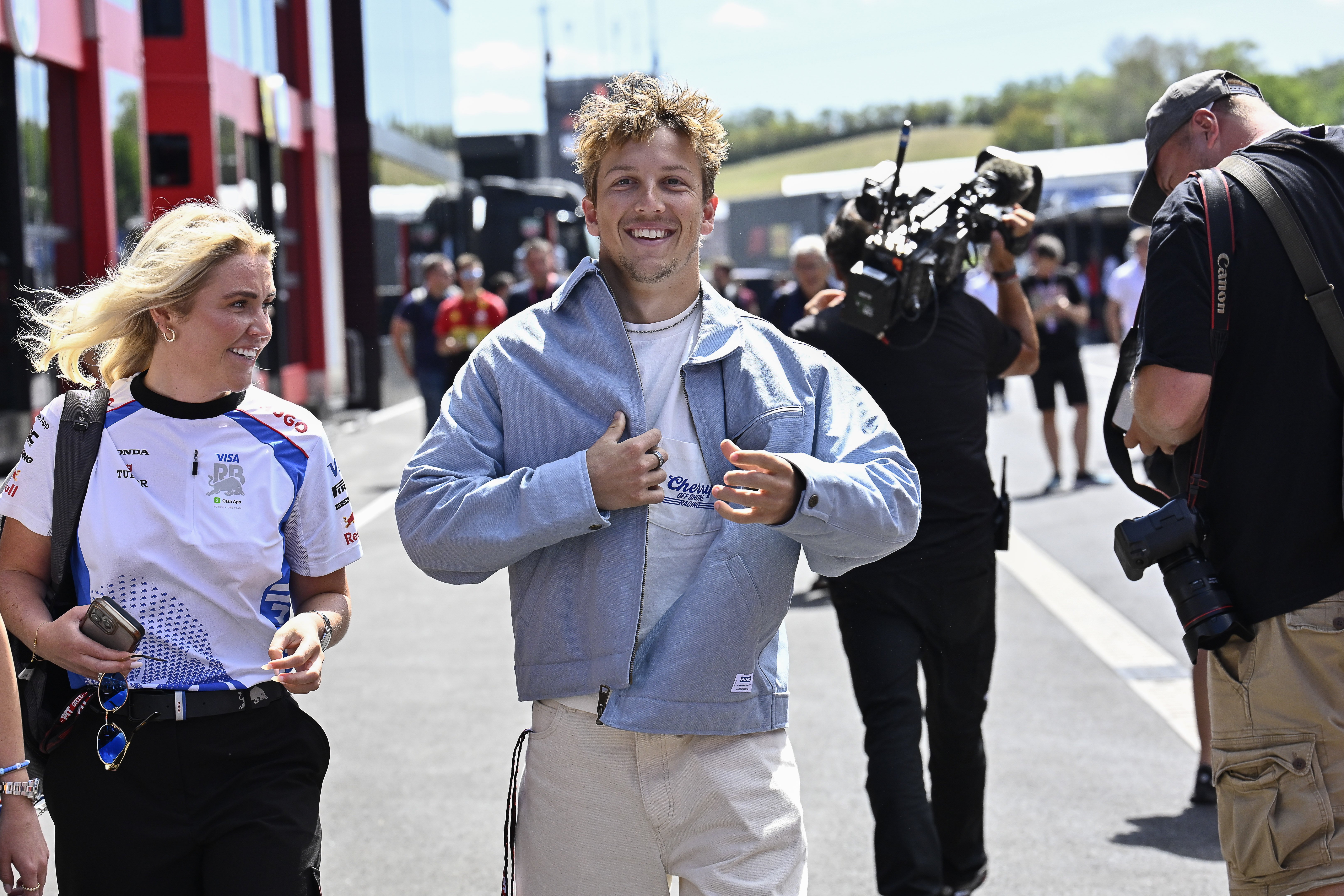Racing Bulls driver Liam Lawson, pictured here walking through the paddock at the Hungaroring...