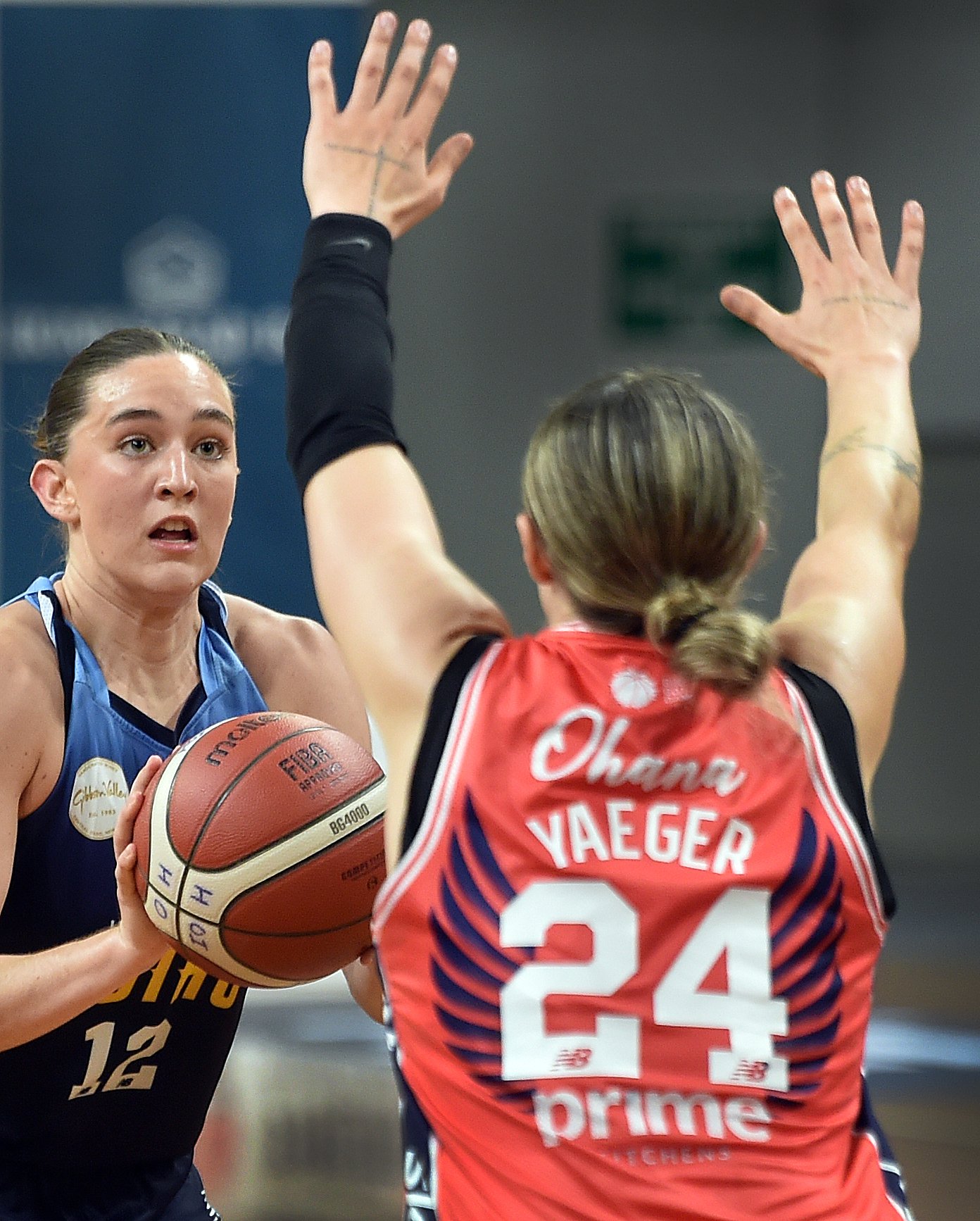 Southern Hoiho number 12 Lillian Dart looks to shoot while defended by Mainland Pouakai number 24...