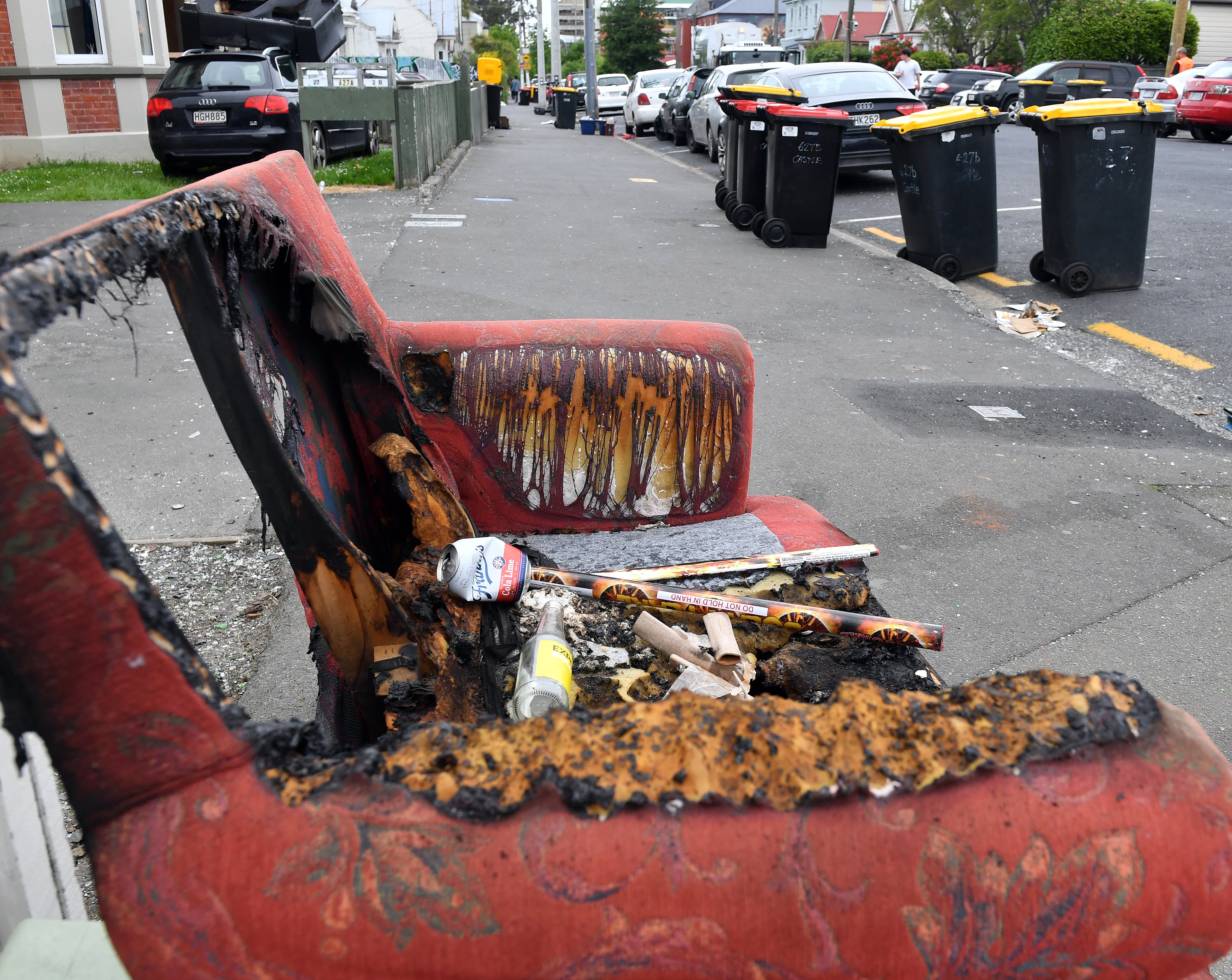 Used fireworks sit atop a damaged couch in Castle St North yesterday morning. PHOTO: STEPHEN...