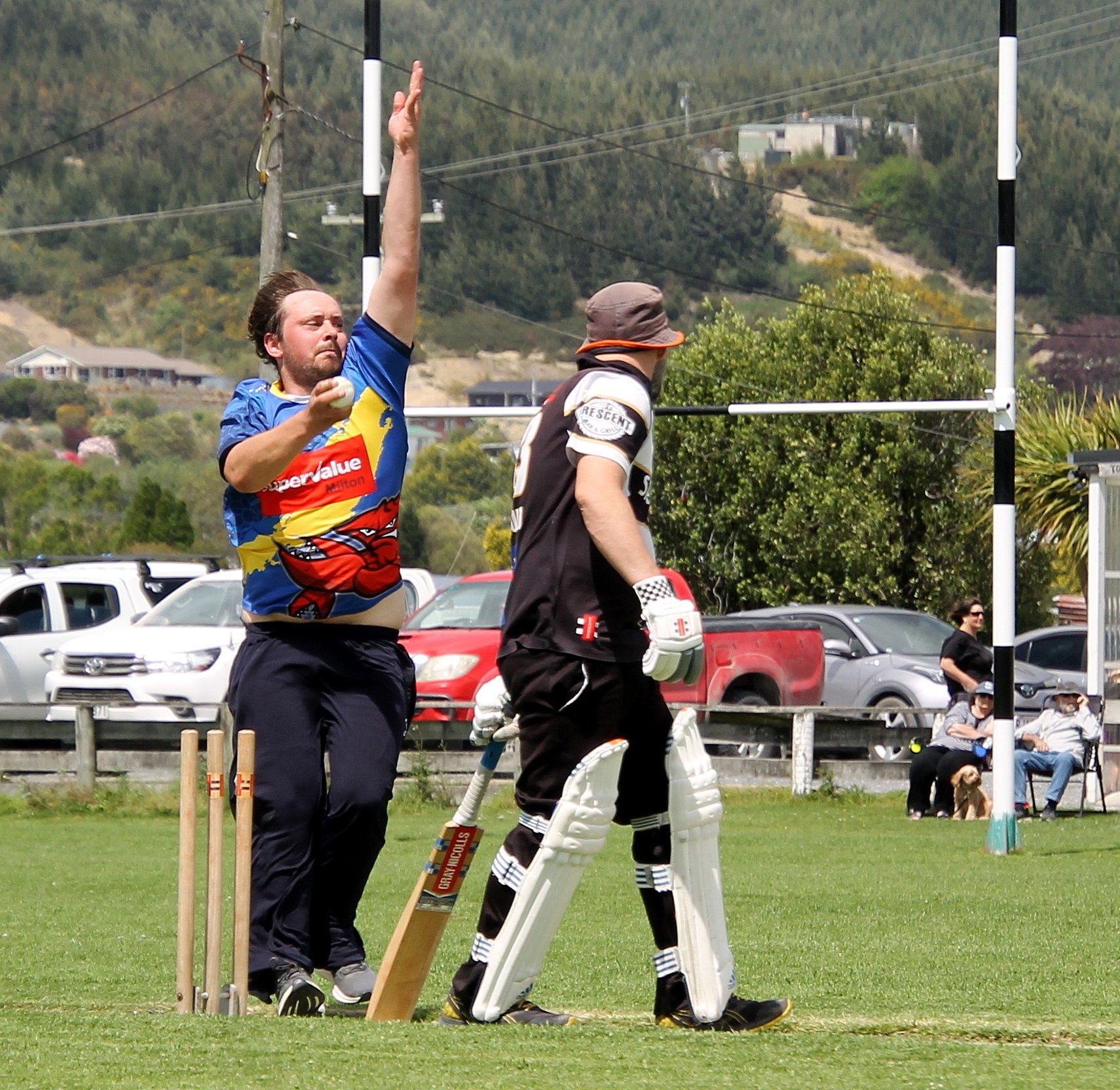 Jason Young stands clear of wicket-skittling Milton bowler Jamie McSkimming, in Kaitangata on...
