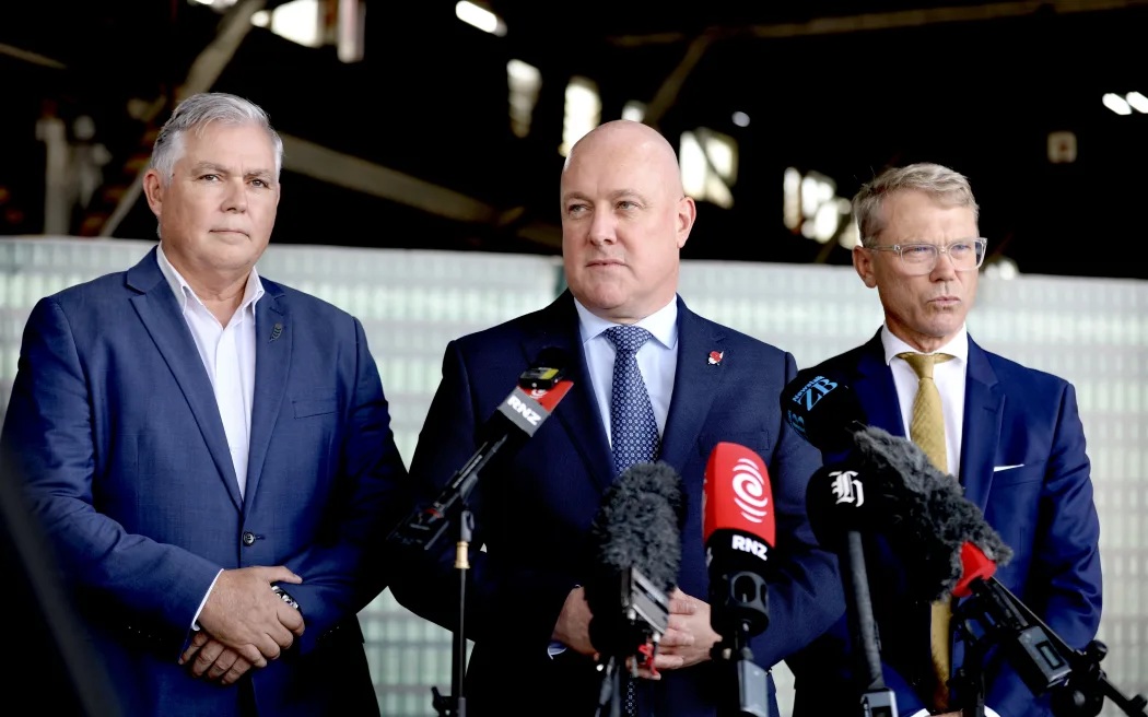 Police Minister Mark Mitchell (L), Prime Minister Christopher Luxon (C) and Justice Minister Paul...