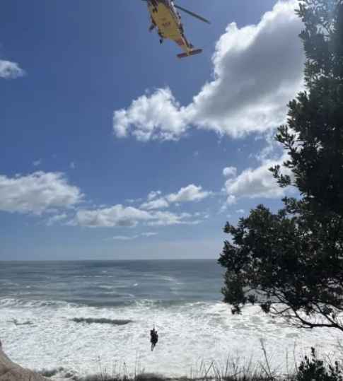 A person is rescued after getting into trouble at the Whiritoa blowhole in Coromandel. Photo: NZ...
