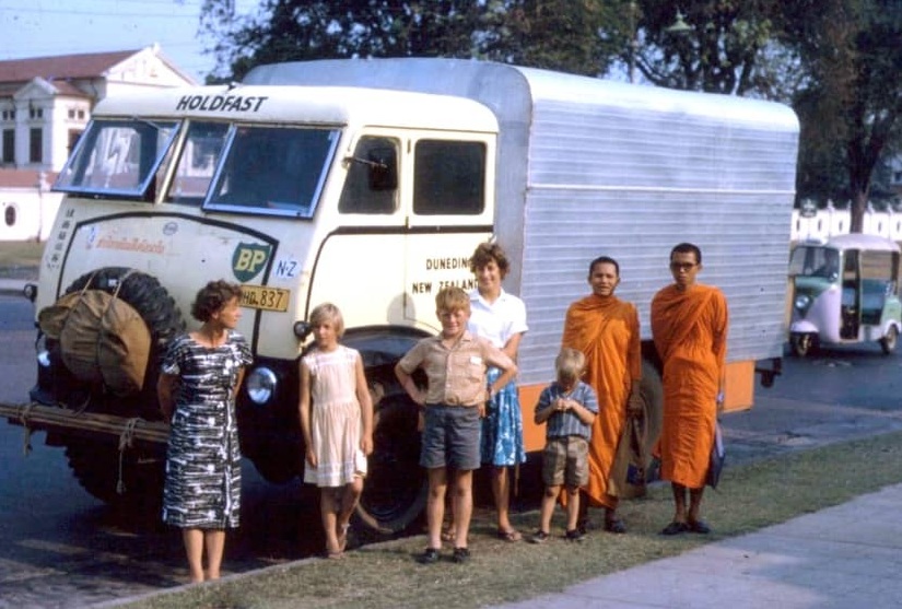 Five of the MacLeods in front of 'Holdfast' with monks in Bangkok, Thailand. Photo: Supplied by...