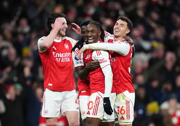 Eberechi Eze (centre) celebrates his third goal during Arsenal's win over Spurs at the Emirates...